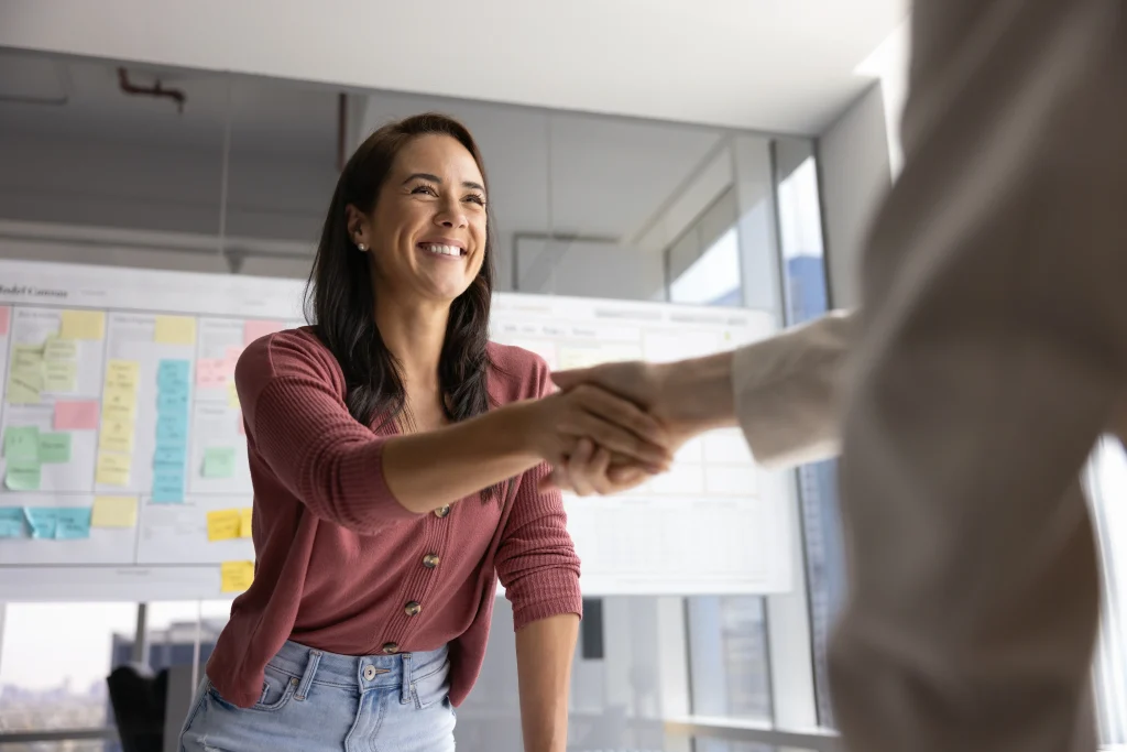 Insurance agent and client shaking hands after issuing a certificate of insurance
