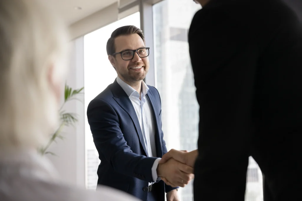 Successful meeting between insurance agent and client with certificate of insurance on the table