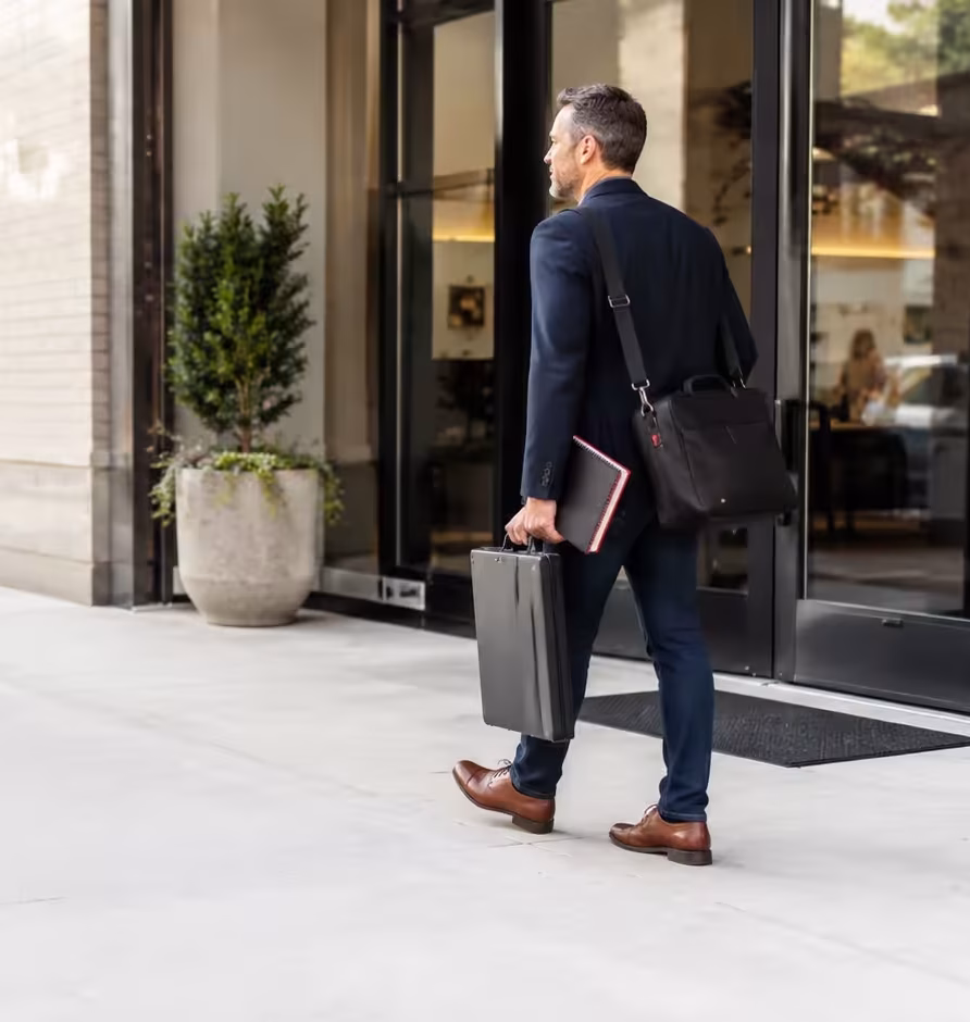 Business consultant arriving at a client location with a mobile work setup.