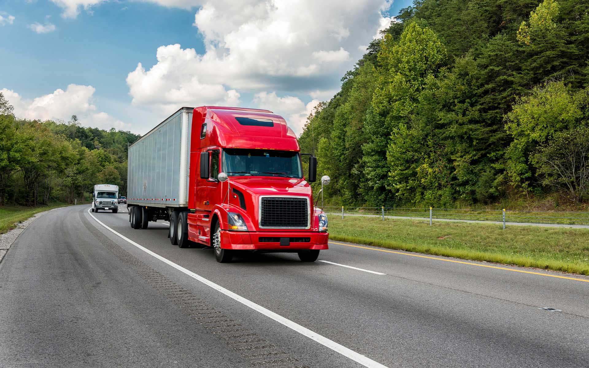 Instant-Online-Truck-Insurance-Estimate-Red-Truck-Driving-Down-the-Road