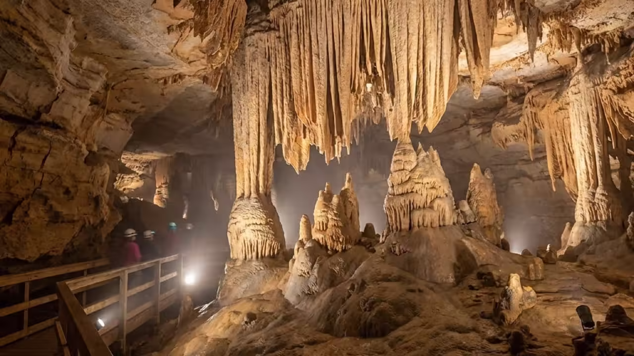 Detailed interior view of Mammoth Cave in Kentucky featuring stalactites and stalagmites